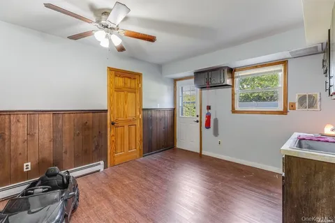 a workspace with furniture and a wooden floor