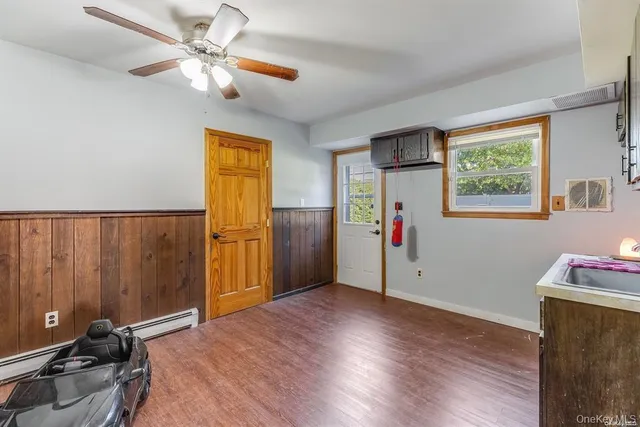 a workspace with furniture and a wooden floor