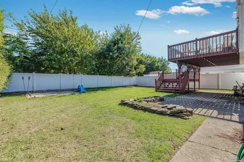 a balcony with wooden floor and fence