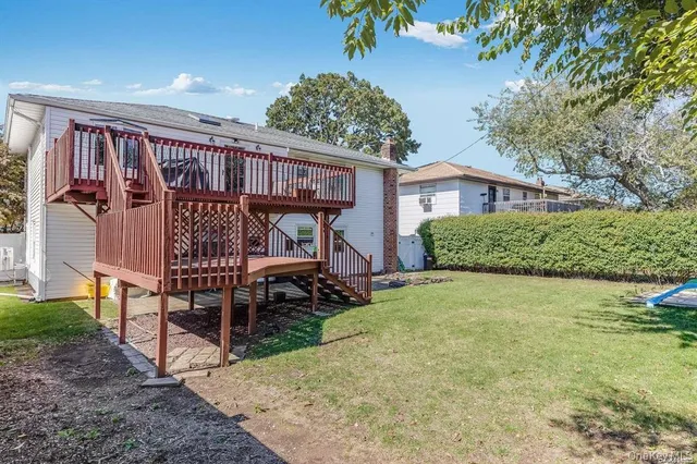 a view of a house with swimming pool and sitting area