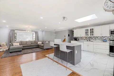 a large kitchen with stainless steel appliances lots of counter top space