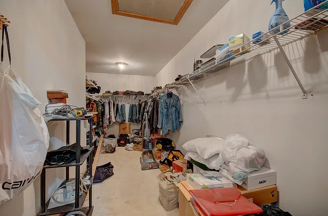 a bathroom with a double vanity sink mirror and toilet