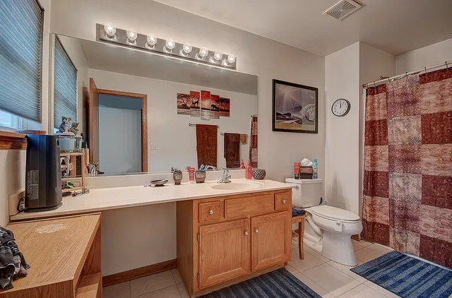 a bedroom with bed and window