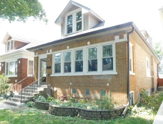 Undisclosed Address Chicago, IL 60630 - Photo 1 of 16 front view of a house with a yard