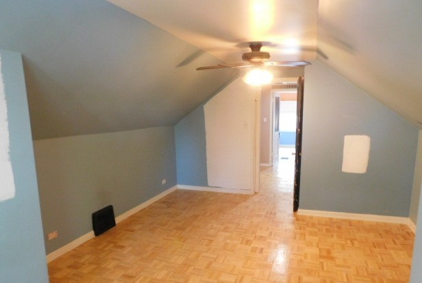 Undisclosed Address Chicago, IL 60630 - Photo 8 of 16 a view of a big room with a chandelier fan