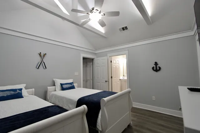 a living room with couches and painted walls