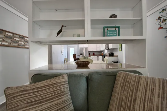 a kitchen with stainless steel appliances granite countertop a sink and cabinets