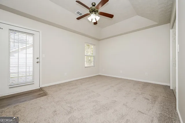 a view of an empty room with a window