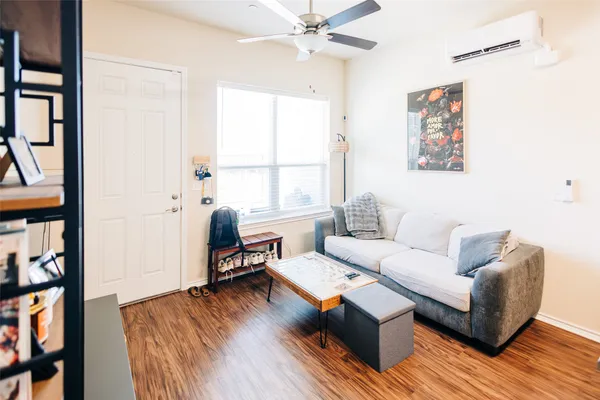 a living room with furniture and a window