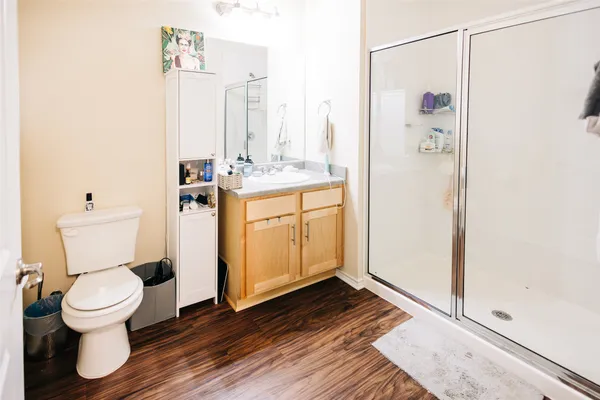 a bathroom with a toilet sink and a mirror