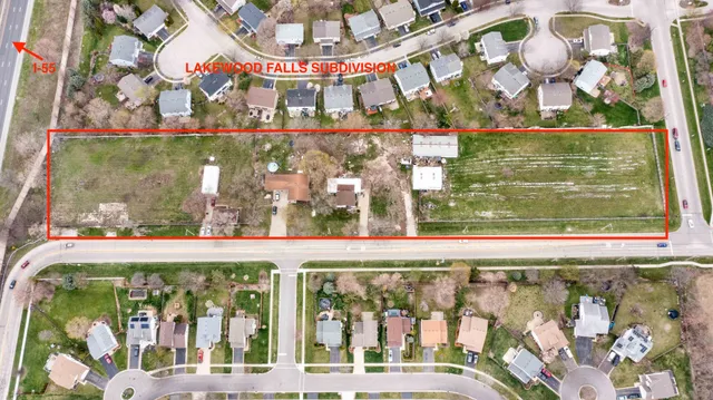 a view of a house with a yard and sitting area