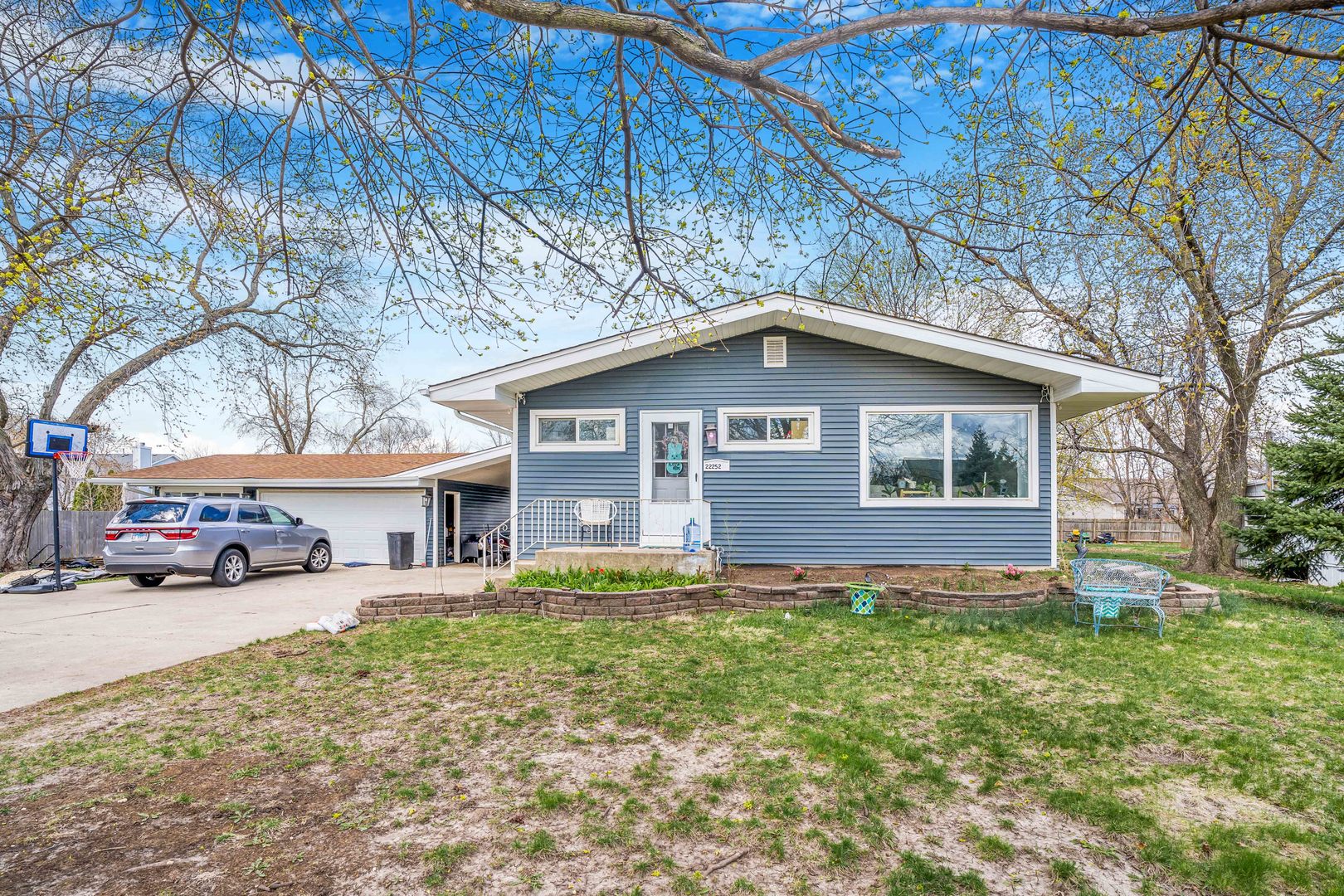 22252 West Taylor Road Plainfield, IL 60544 - Photo 2 of 29 a view of a house with a yard and sitting area