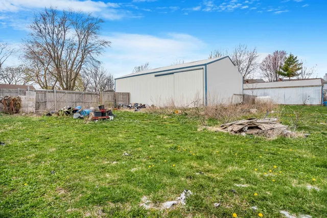 a view of a backyard with large trees