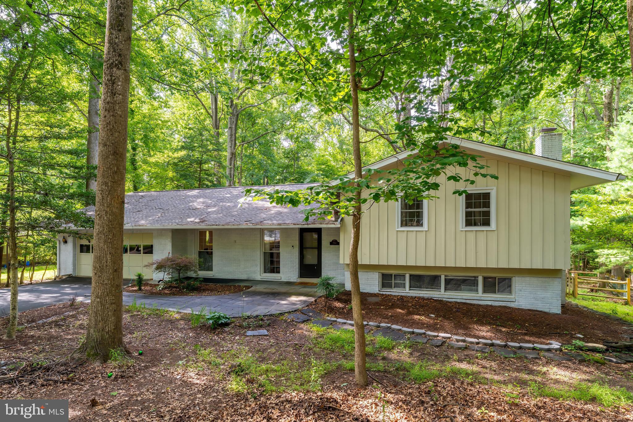 11621 Sourwood Lane Reston, VA 20191 - Photo 3 of 26 a backyard of a house with barbeque oven