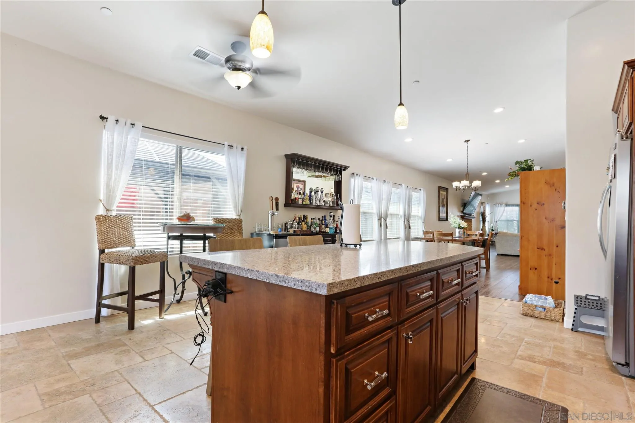 1243 Peach Avenue El Cajon, CA 92021 - Photo 16 of 27 a kitchen with counter top space cabinets and refrigerator