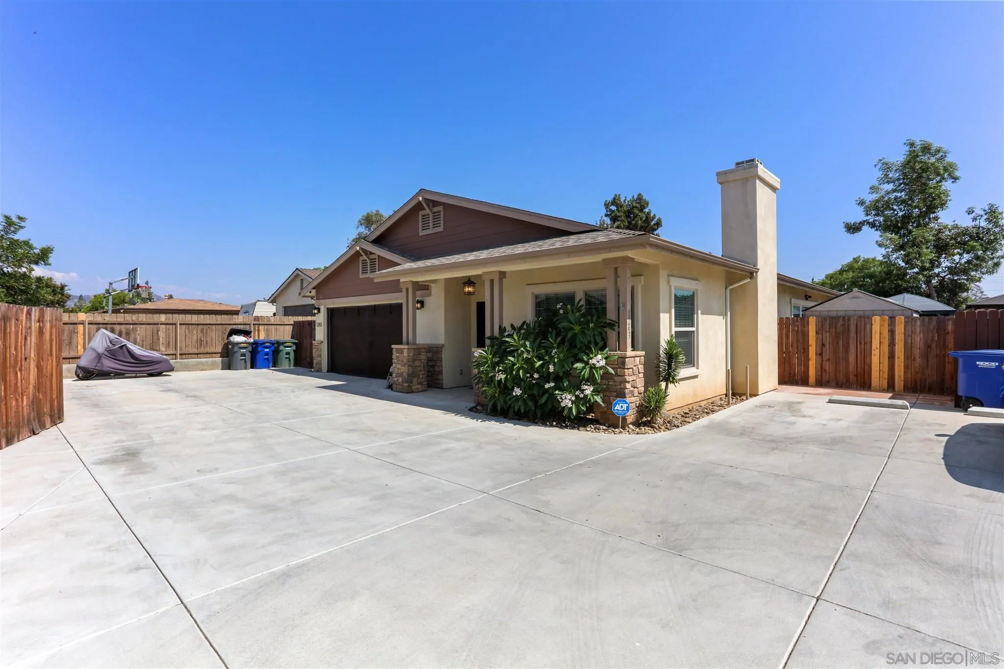 1243 Peach Avenue El Cajon, CA 92021 - Photo 2 of 27 a view of a house with a yard and potted plants
