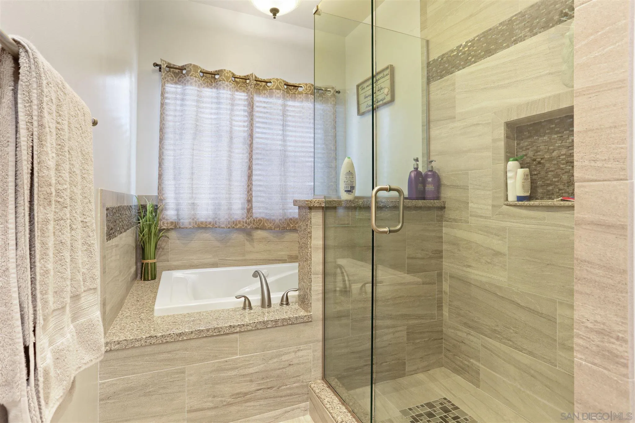 1243 Peach Avenue El Cajon, CA 92021 - Photo 26 of 27 a bathroom with a shower and a bathtub