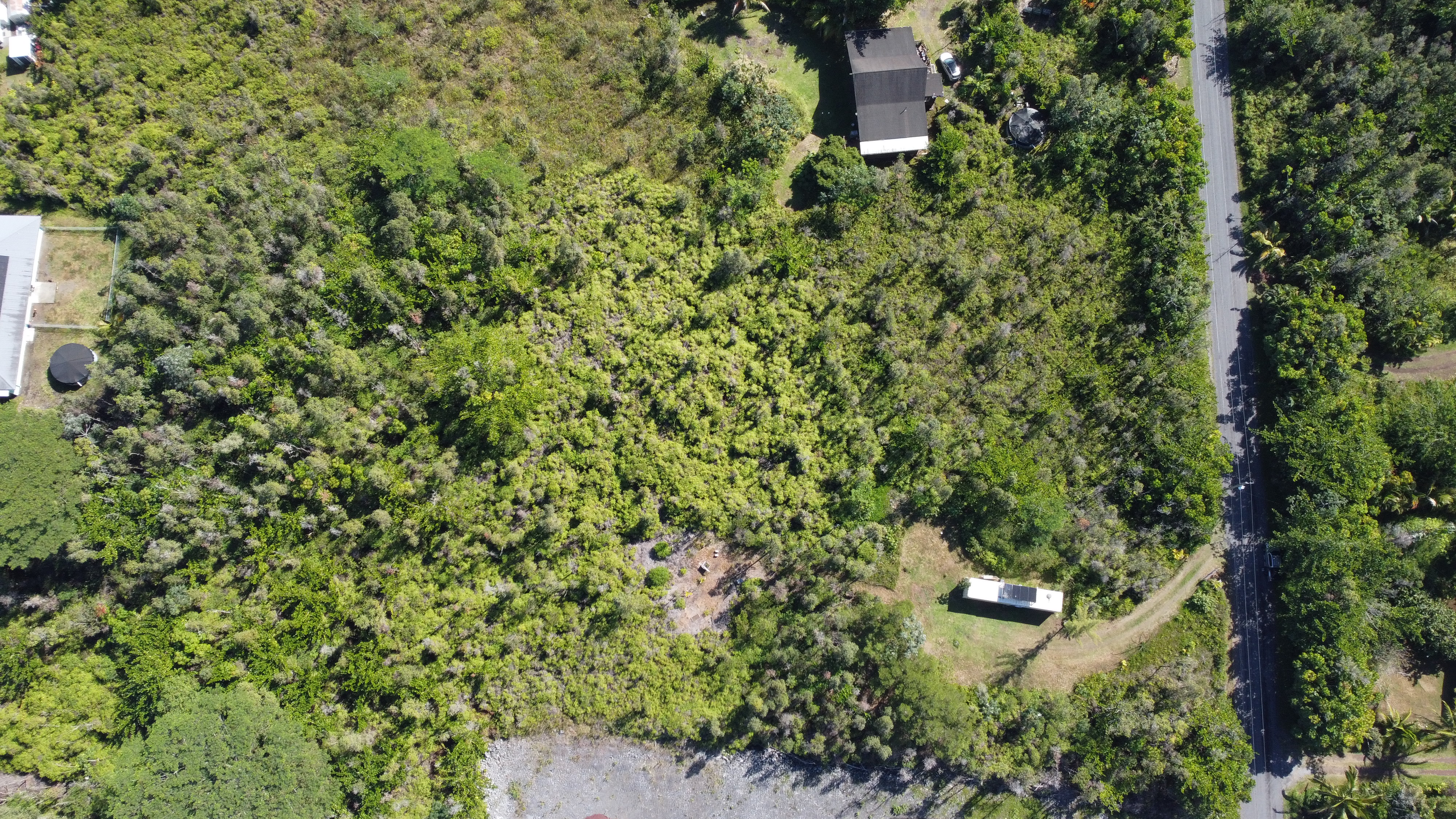 2709 3rd Avenue Keaau, HI 96749 - Photo 18 of 19 an aerial view of a house with a yard