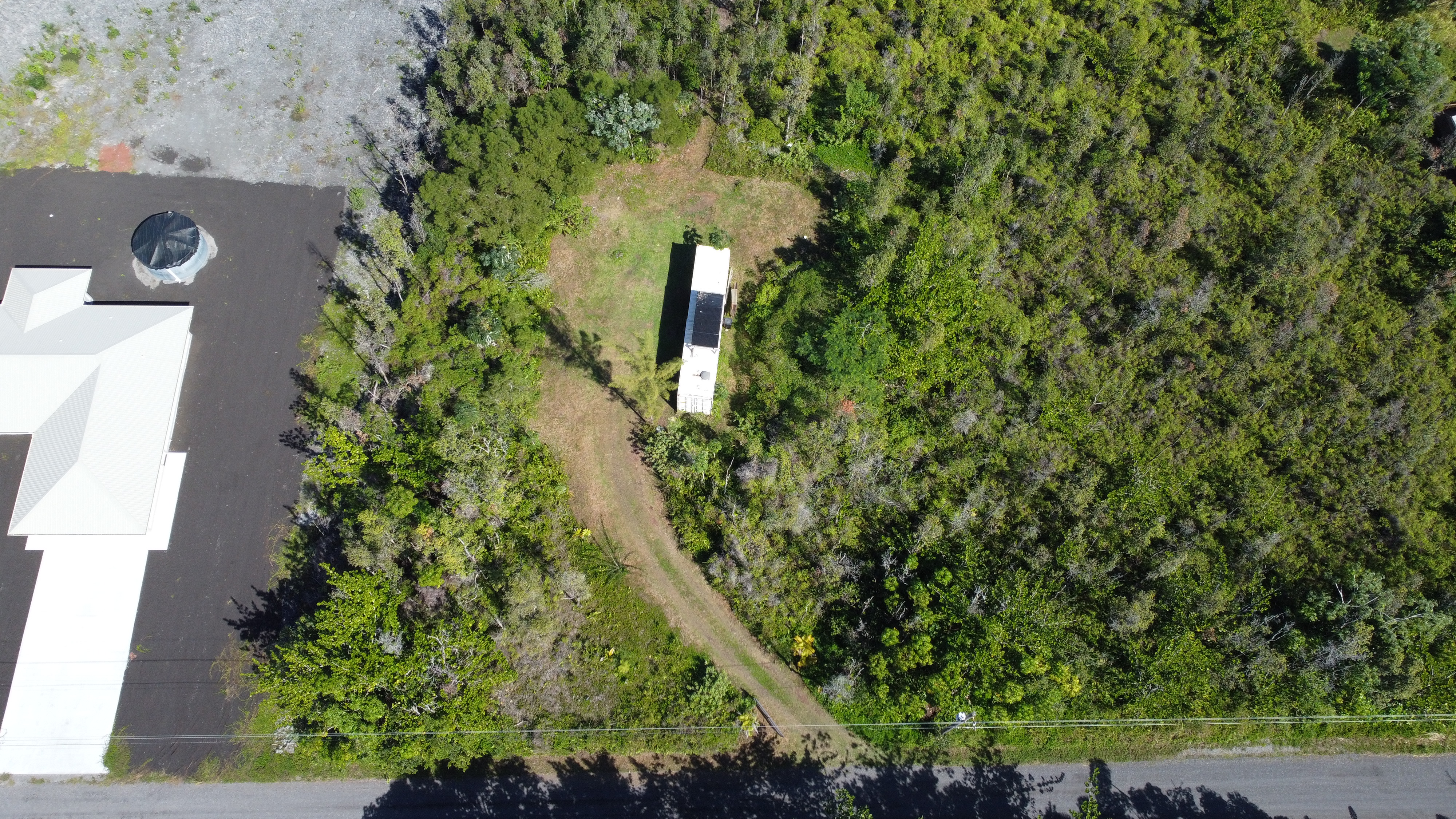 2709 3rd Avenue Keaau, HI 96749 - Photo 3 of 19 an aerial view of a house with a yard