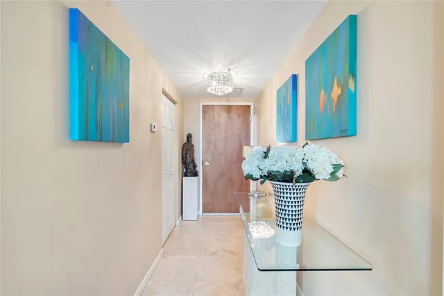 a view of a hallway with wooden door