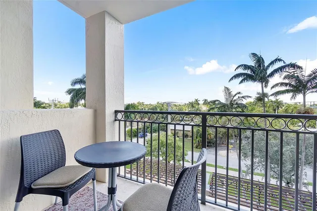 a view of a balcony with chairs