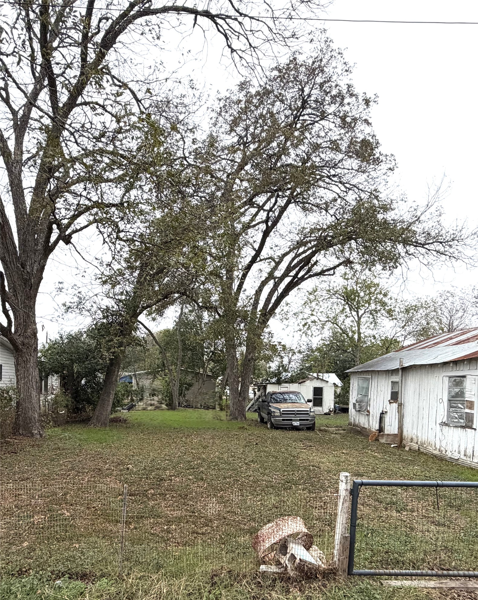 0 Persimmon Street Lockhart, TX 78644 - Photo 4 of 4 a front view of a house with a yard and garage