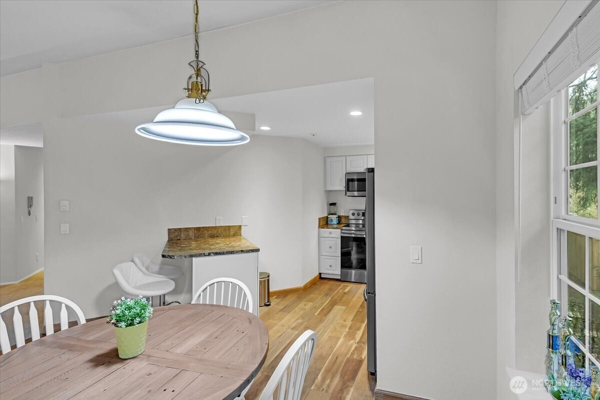 8653 Avondale Road Northeast, Unit D208 Redmond, WA 98052 - Photo 12 of 32 a view of a dining room with furniture