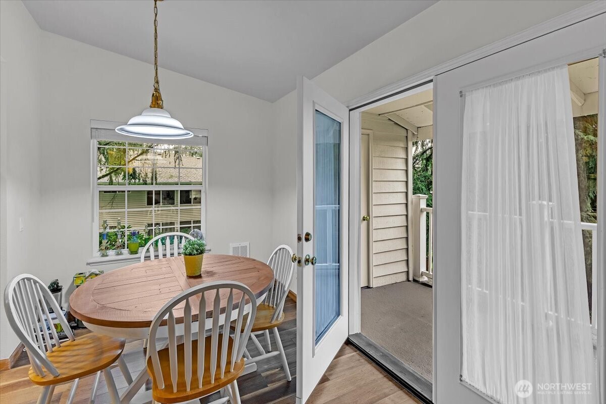 8653 Avondale Road Northeast, Unit D208 Redmond, WA 98052 - Photo 13 of 32 a dining room with a window and furniture