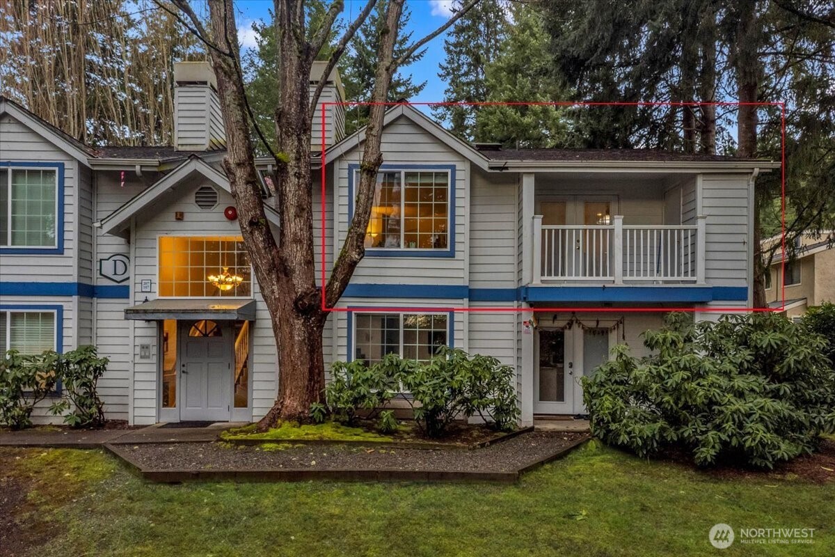 8653 Avondale Road Northeast, Unit D208 Redmond, WA 98052 - Photo 2 of 32 a front view of a house with a yard