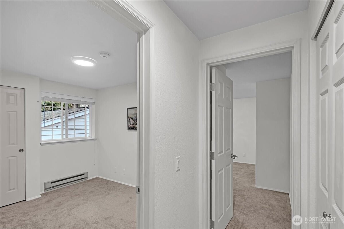 8653 Avondale Road Northeast, Unit D208 Redmond, WA 98052 - Photo 25 of 32 a view of an empty room with windows and closet