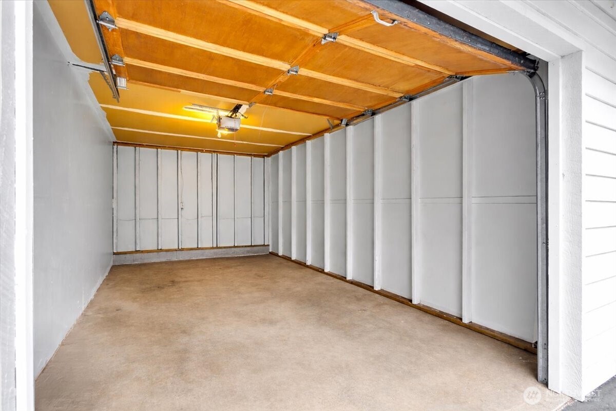 8653 Avondale Road Northeast, Unit D208 Redmond, WA 98052 - Photo 29 of 32 a view of a room with a small space and wooden deck