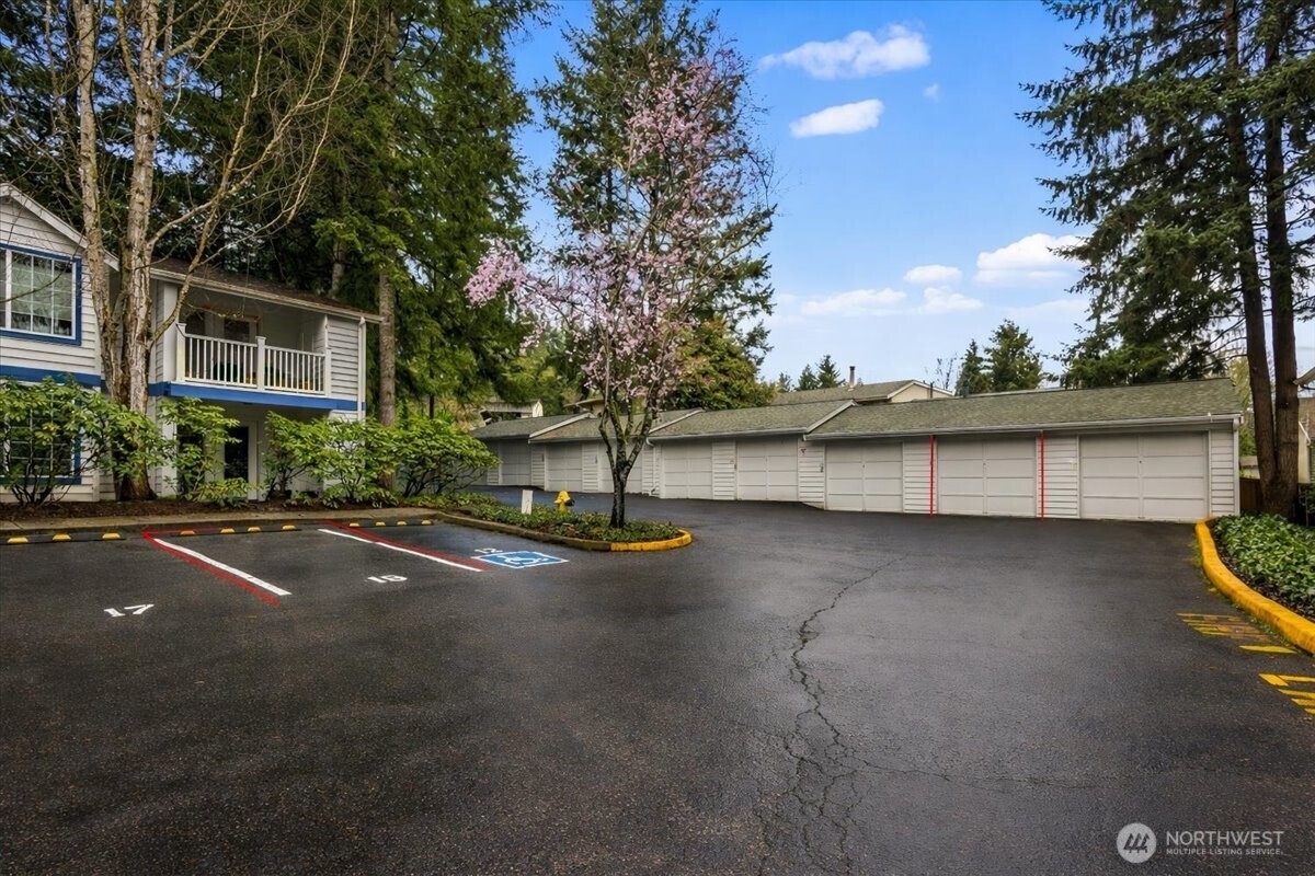 8653 Avondale Road Northeast, Unit D208 Redmond, WA 98052 - Photo 31 of 32 a view of street with parked cars