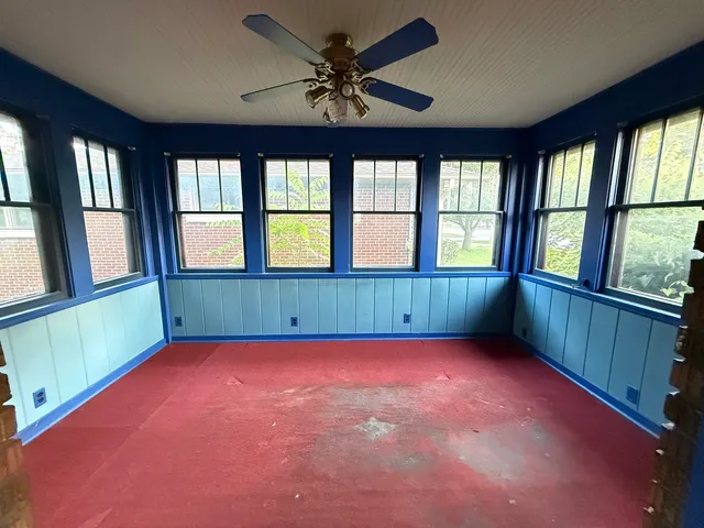 a view of an empty room with a window