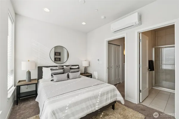 a bedroom with a bed and a cabinets