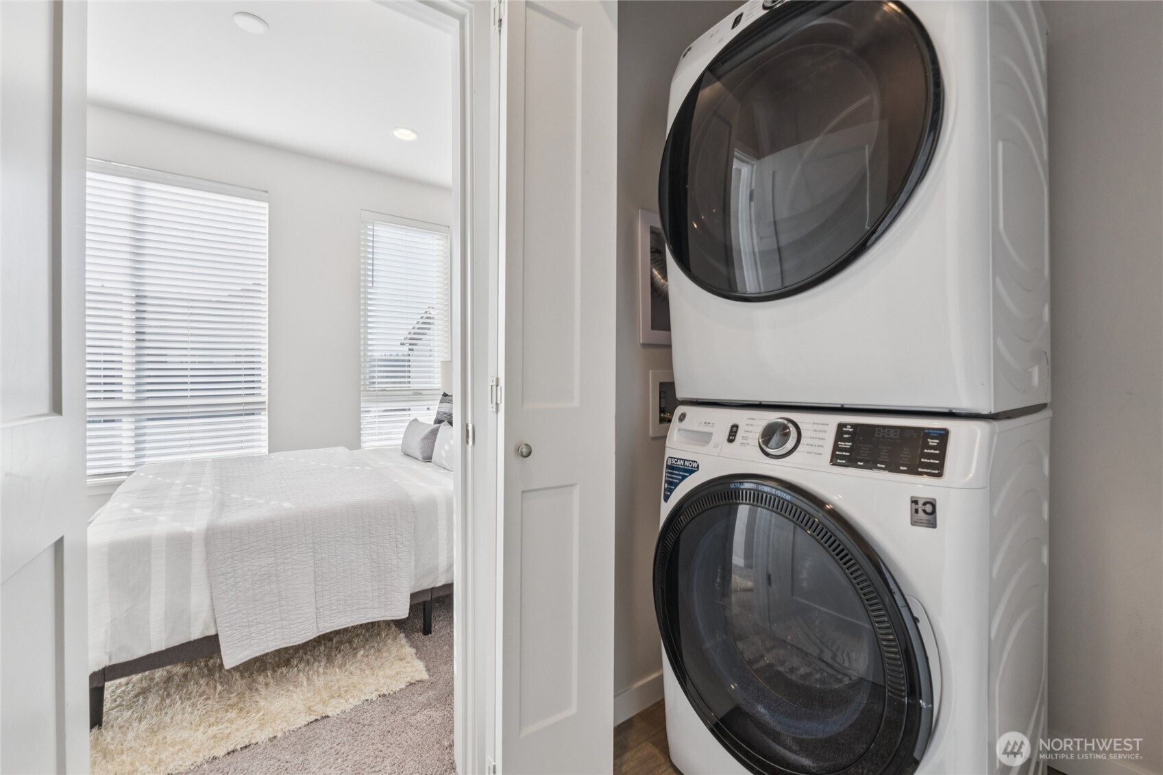 10942 Northeast 189th Place, Unit E Bothell, WA 98011 - Photo 15 of 24 a room with a washer and dryer