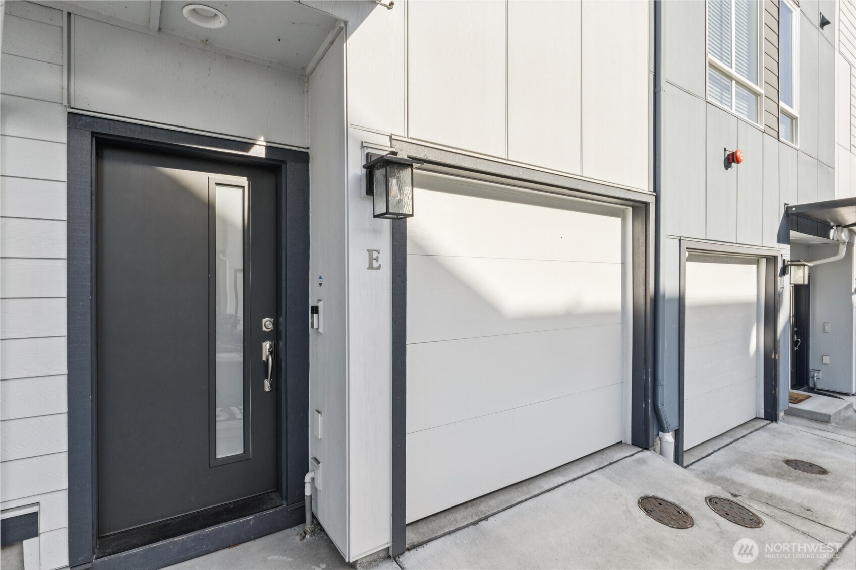 10942 Northeast 189th Place, Unit E Bothell, WA 98011 - Photo 2 of 24 a view of a refrigerator in kitchen and an empty room