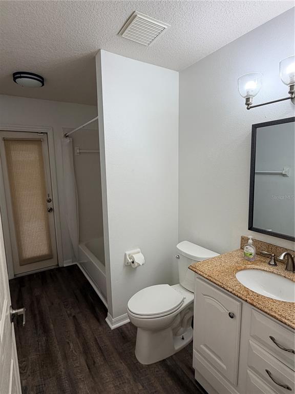 4111 Amber Ridge Lane Valrico, FL 33594 - Photo 19 of 27 a bathroom with a granite countertop toilet sink and mirror