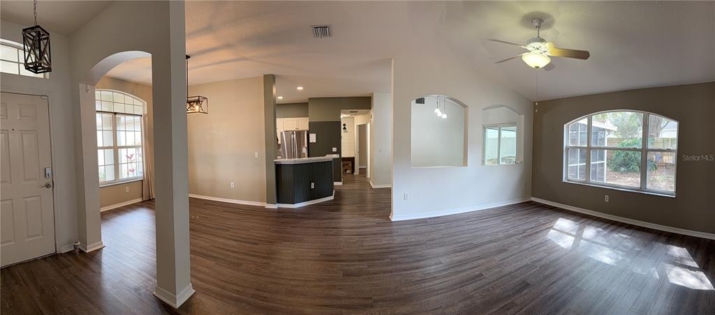 4111 Amber Ridge Lane Valrico, FL 33594 - Photo 7 of 27 wooden floor in an empty room with a window