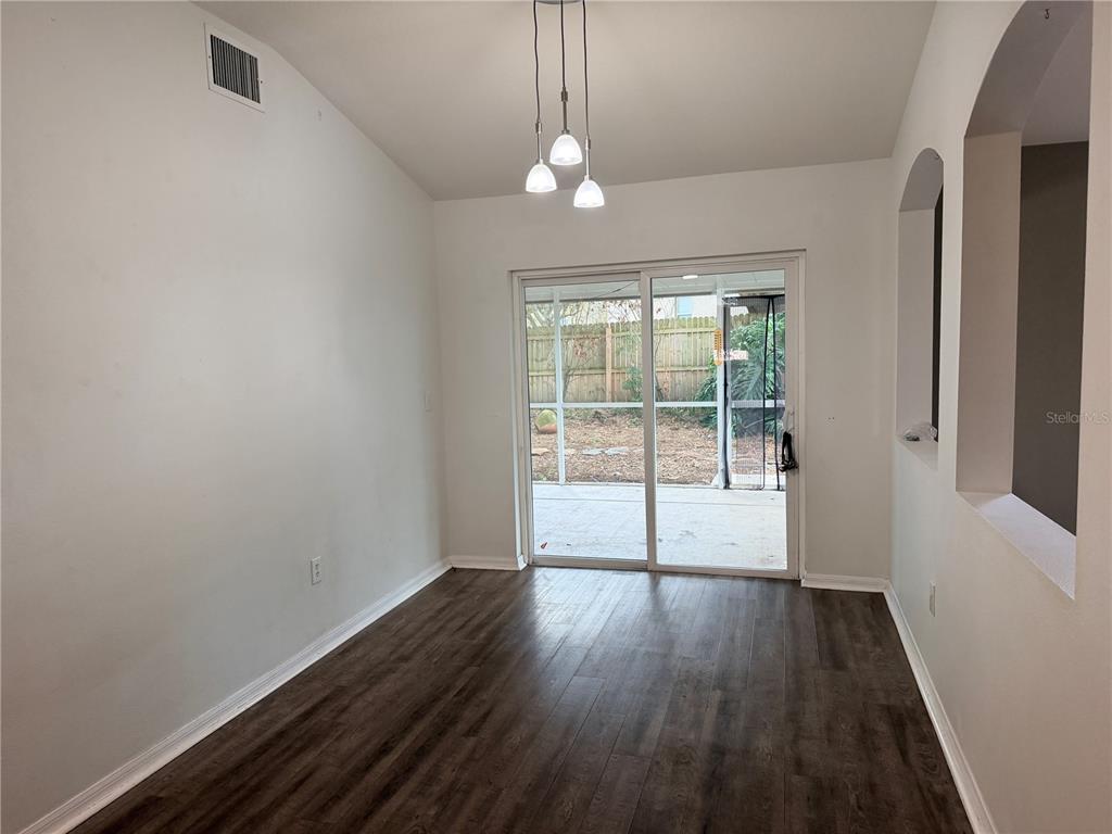 4111 Amber Ridge Lane Valrico, FL 33594 - Photo 9 of 27 a view of wooden floor and windows in a room