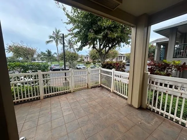 a view of a fence and yard