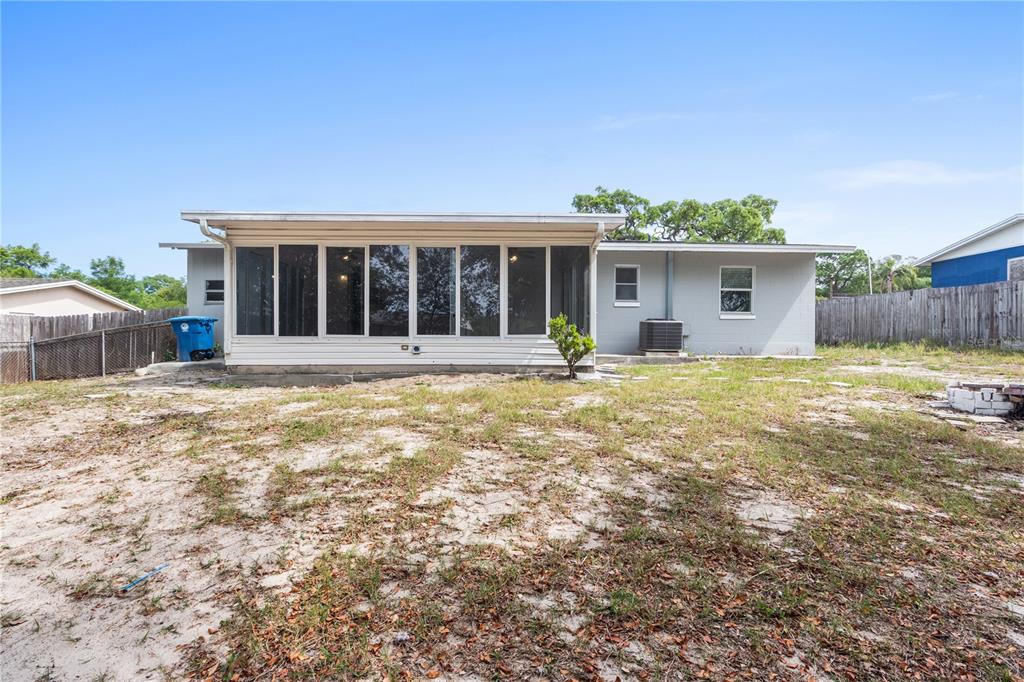 7208 Fair Oaks Street Spring Hill, FL 34606 - Photo 23 of 25 front view of a house with a yard