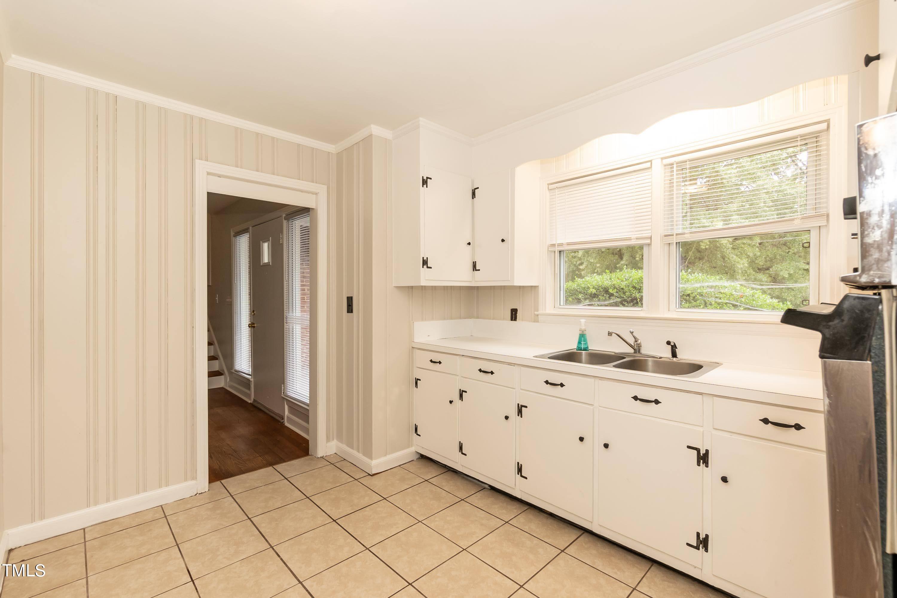 139 Johnson Street Roxboro, NC 27573 - Photo 11 of 30 a bathroom with a sink vanity and a mirror