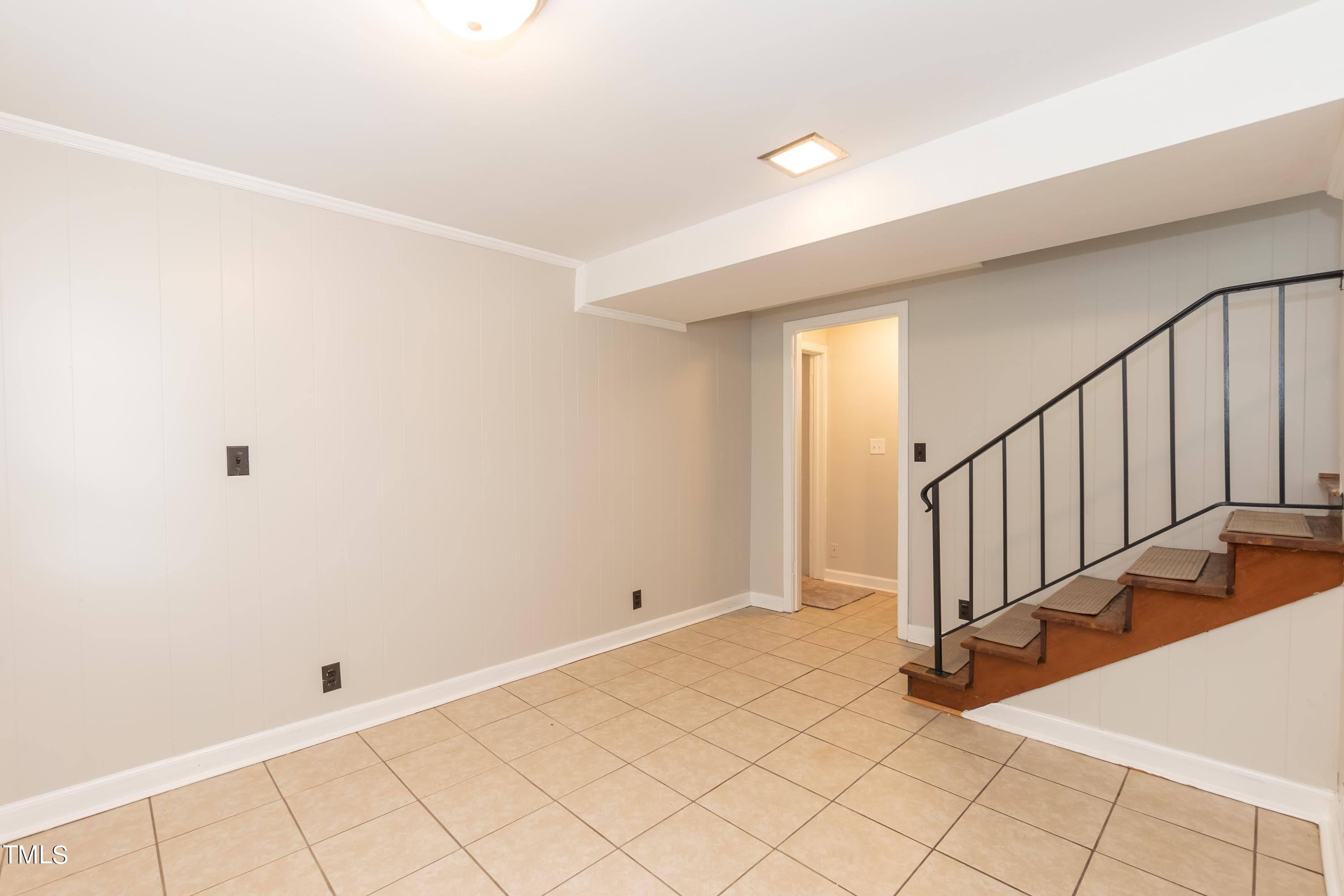 139 Johnson Street Roxboro, NC 27573 - Photo 15 of 30 a view of an empty room with stairs