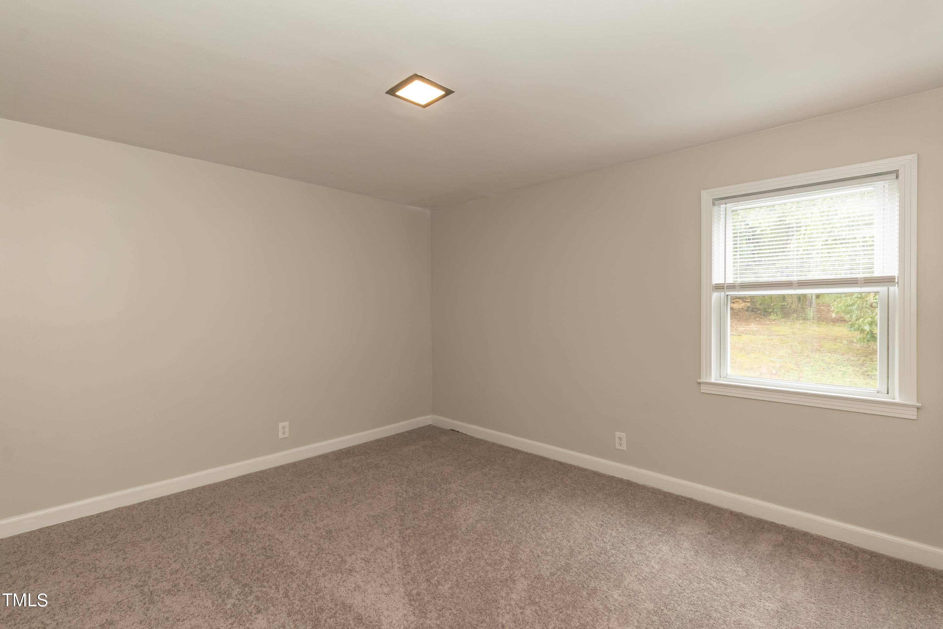 139 Johnson Street Roxboro, NC 27573 - Photo 19 of 30 an empty room with a window