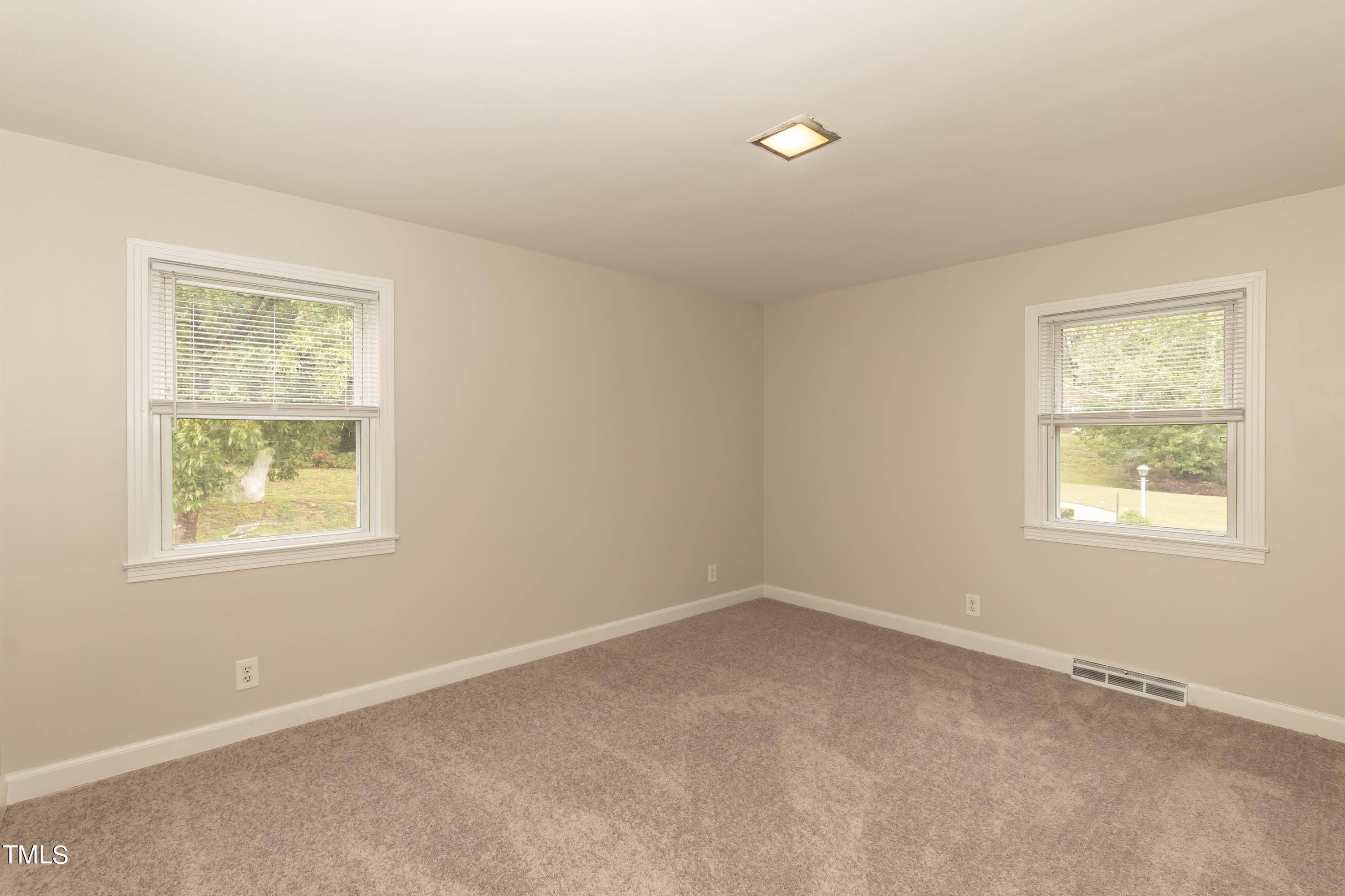 139 Johnson Street Roxboro, NC 27573 - Photo 20 of 30 an empty room with a window