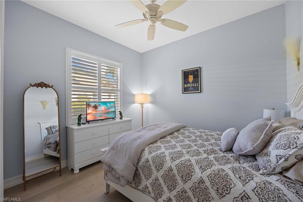 8943 Lely Island Circle Naples, FL 34113 - Photo 23 of 40 a bedroom with a bed and a window
