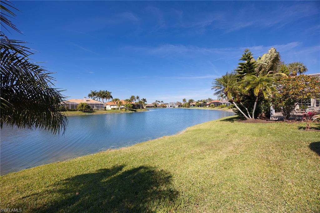8943 Lely Island Circle Naples, FL 34113 - Photo 30 of 40 a view of a lake with houses
