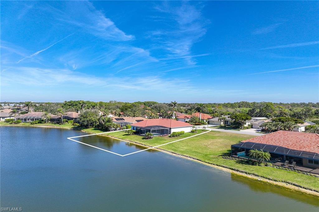 8943 Lely Island Circle Naples, FL 34113 - Photo 37 of 40 an aerial view of residential houses with outdoor space and river