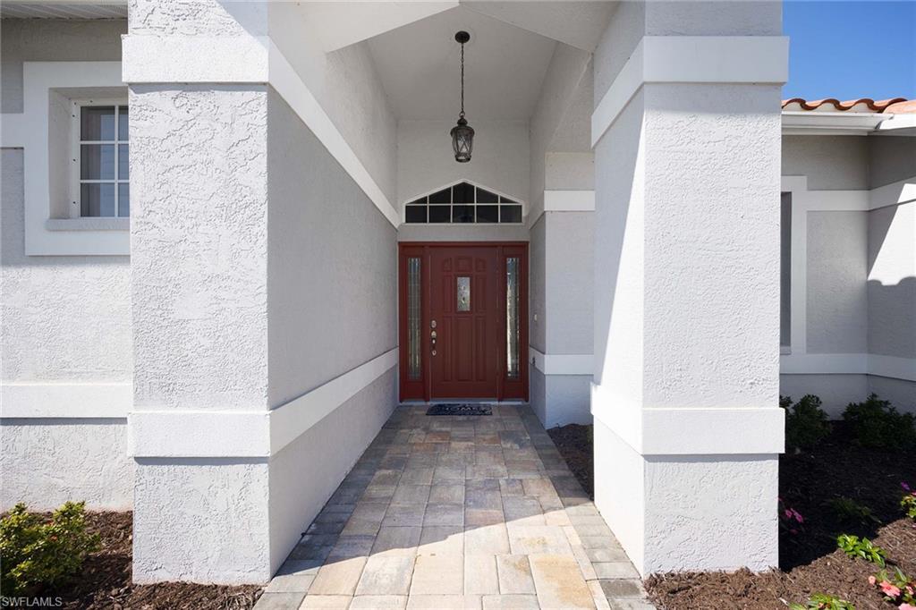 8943 Lely Island Circle Naples, FL 34113 - Photo 5 of 40 a view of a hallway to a livingroom