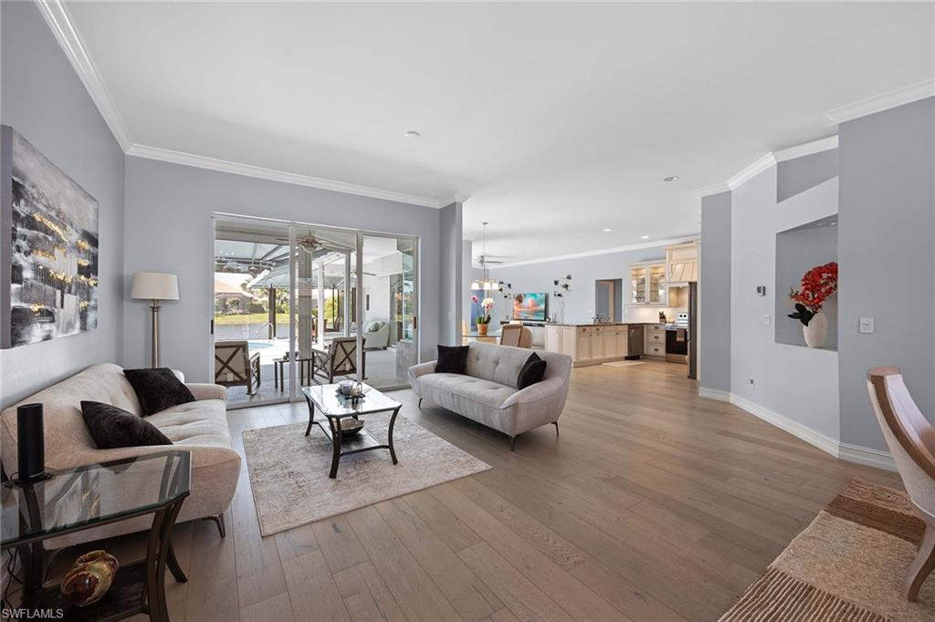 8943 Lely Island Circle Naples, FL 34113 - Photo 8 of 40 a living room with furniture and a large window